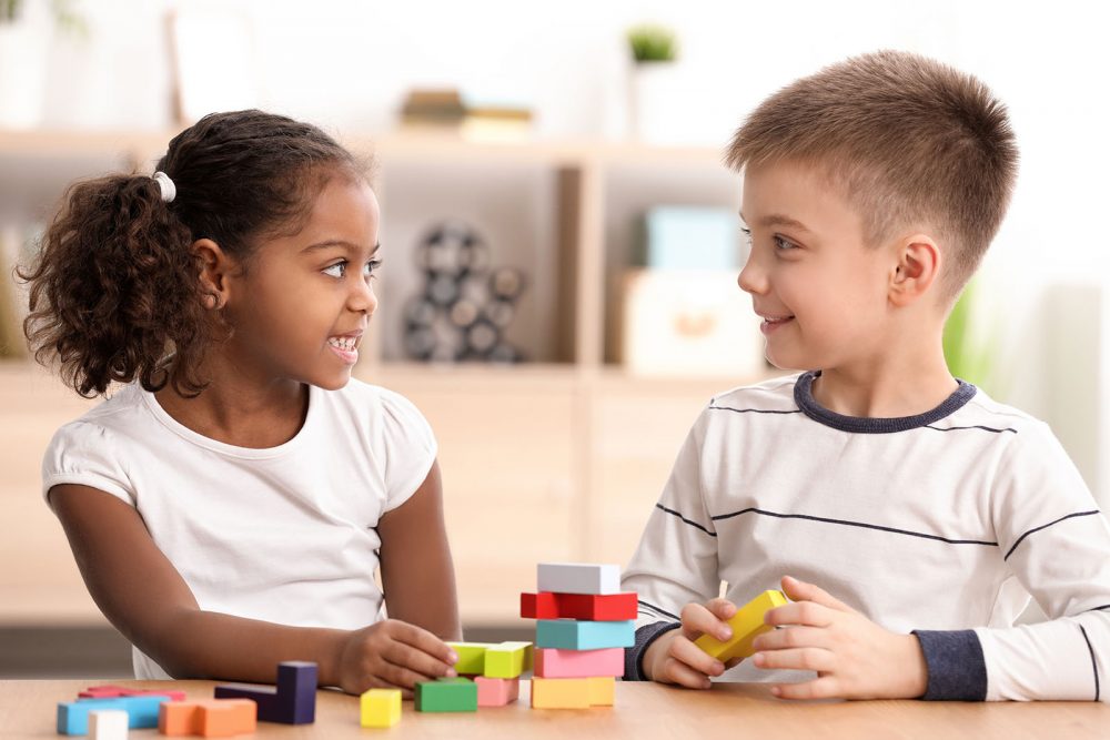 Children playing indoors together.